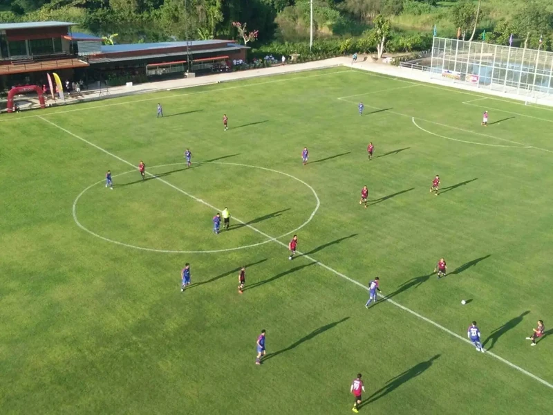 Two teams playing a match on the main pitch, seen from above
